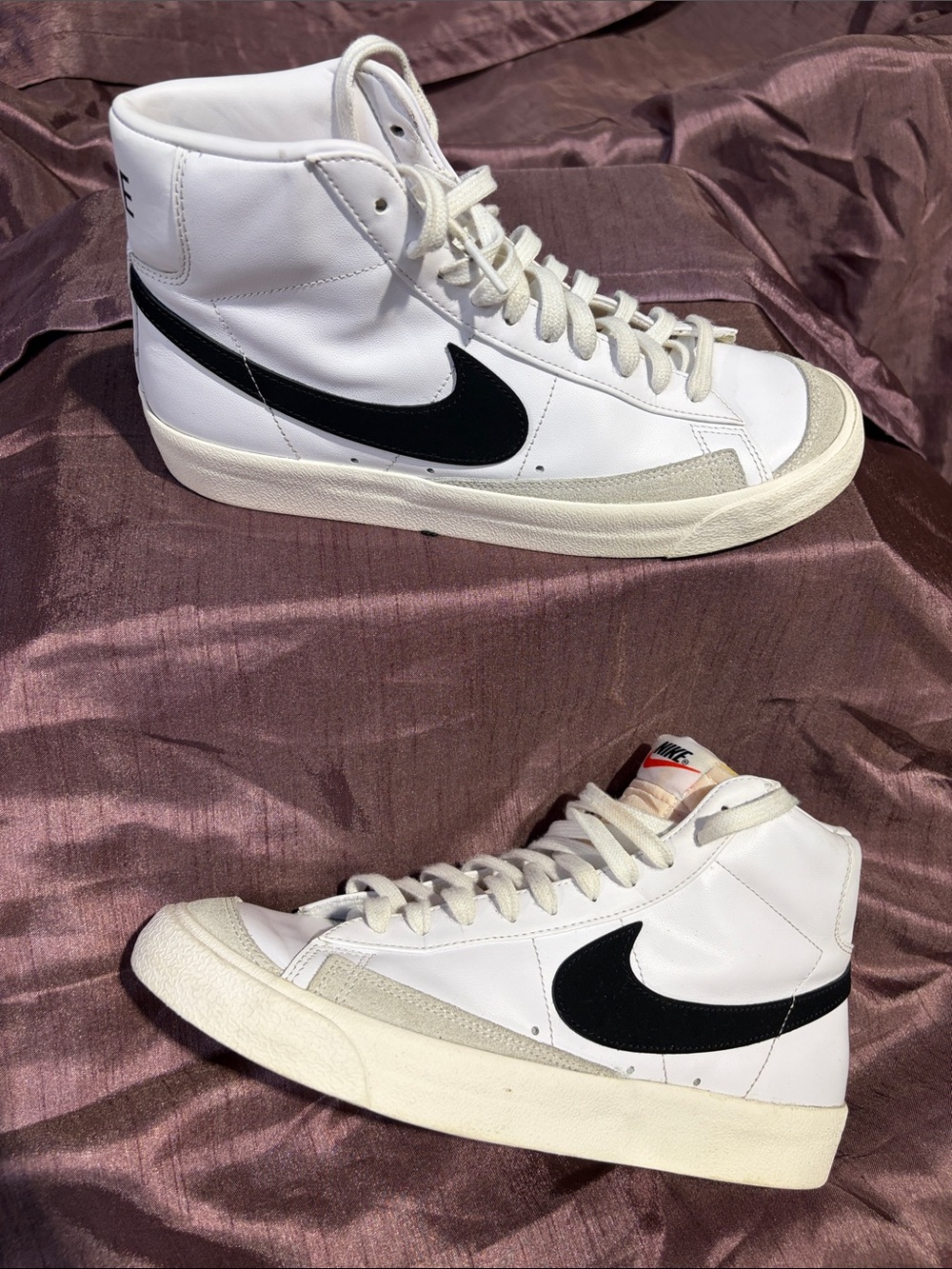 Nike White High-Top Sneakers with Black Swoosh